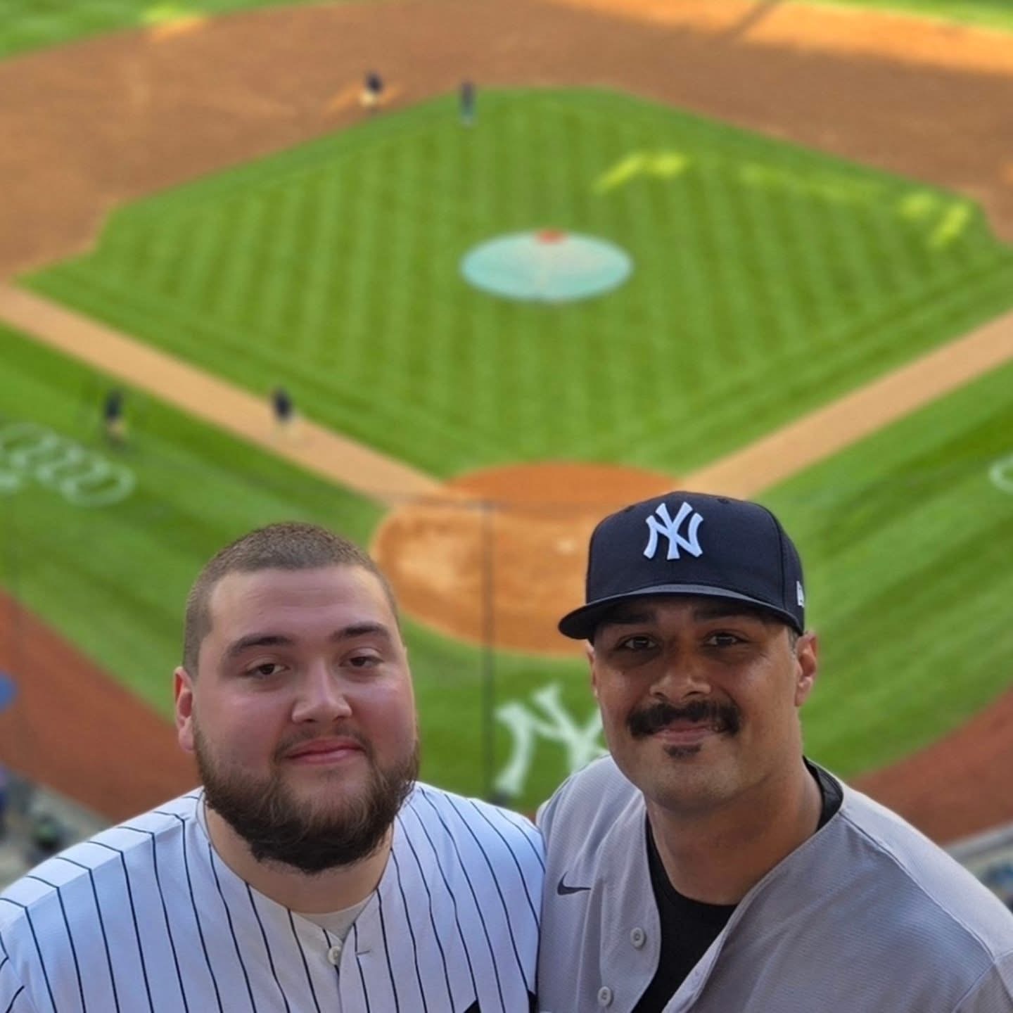 Phil and his little brother enjoying a Yankees game